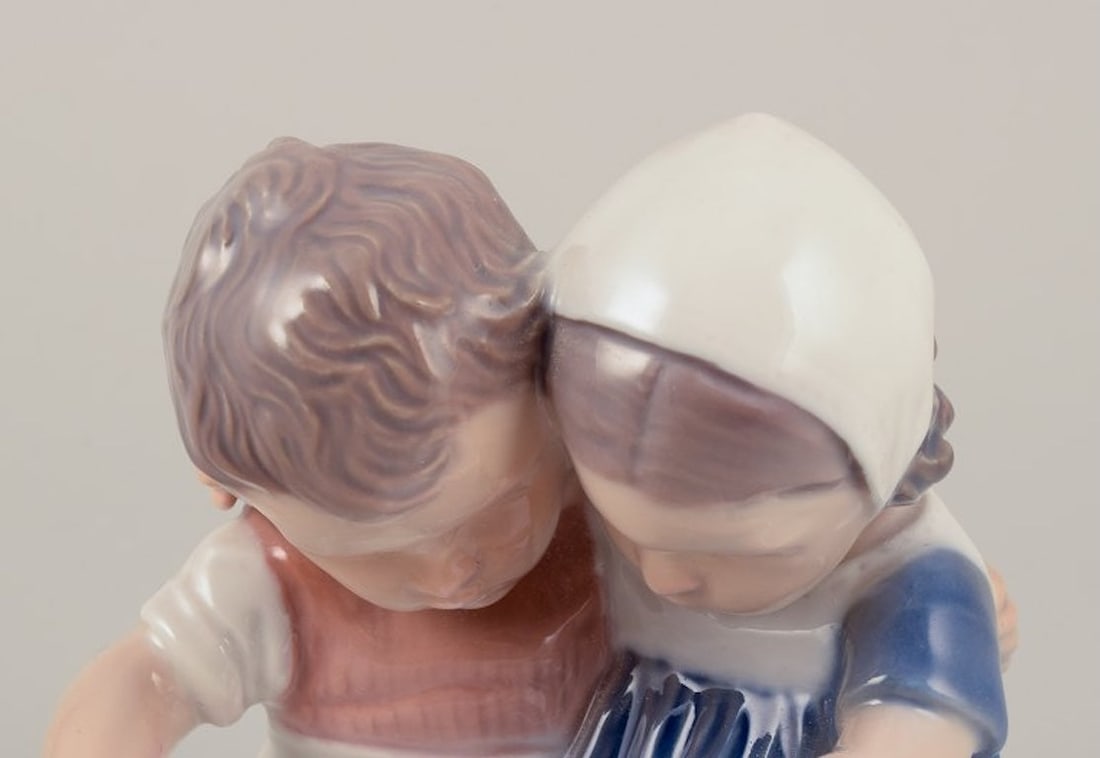 Bing & Grøndahl, Denmark. Porcelain figurine of reading children. Approximately 1930s. - 5