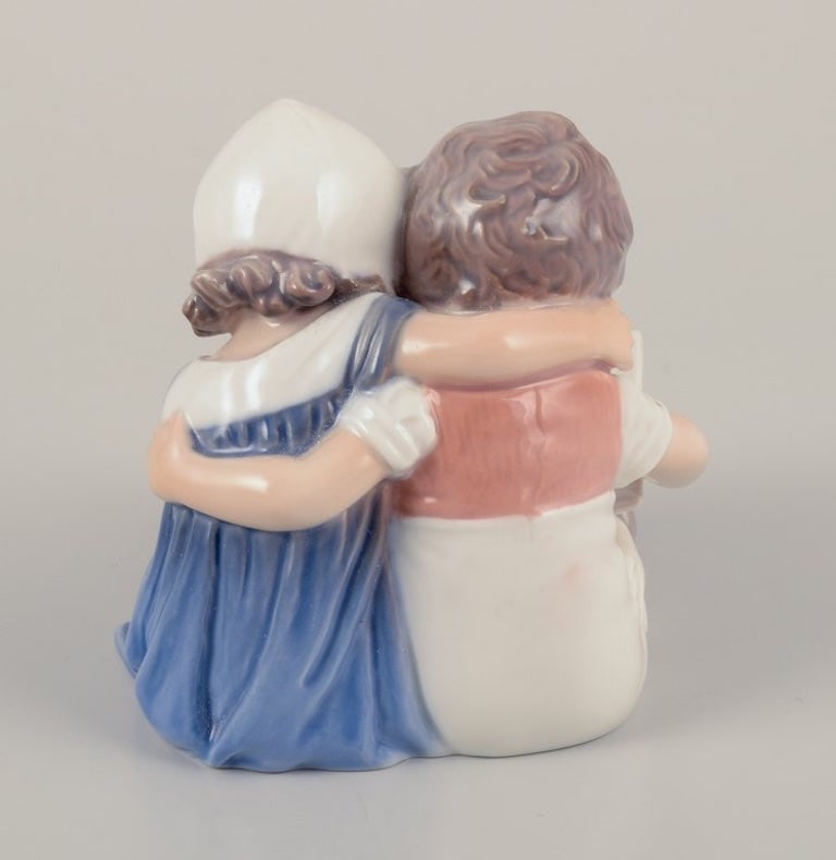 Bing & Grøndahl, Denmark. Porcelain figurine of reading children. Approximately 1930s. - 6