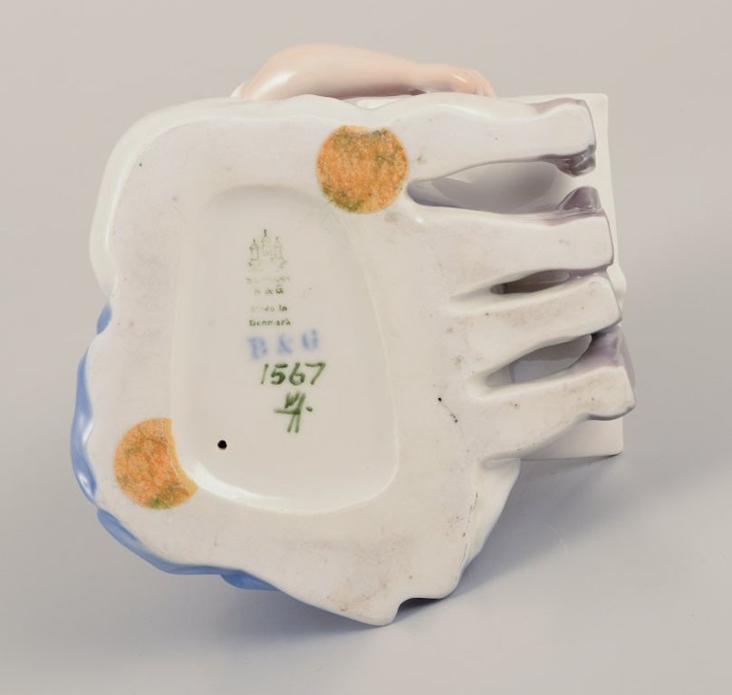 Bing & Grøndahl, Denmark. Porcelain figurine of reading children. Approximately 1930s. - 7