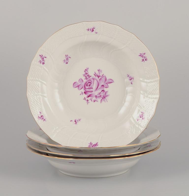 Herend, Hungary. A set of four deep porcelain plates with purple floral motifs. Mid-20th C. (1 of 9)
