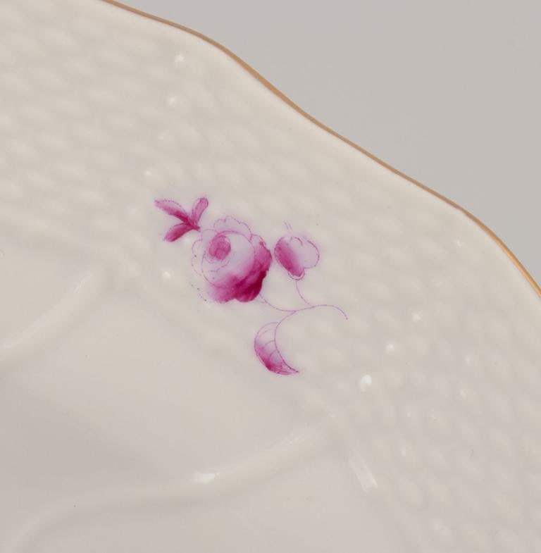 Herend, Hungary. A set of four deep porcelain plates with purple floral motifs. Mid-20th C. - 5