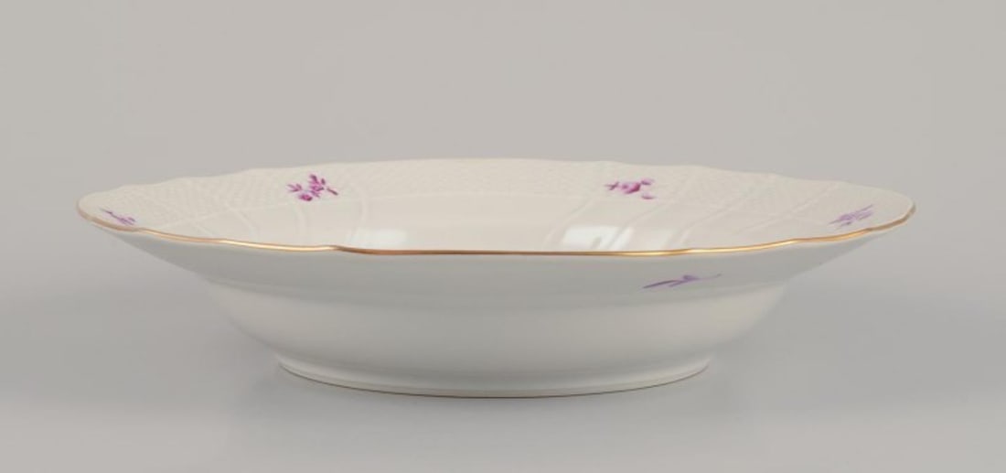 Herend, Hungary. A set of four deep porcelain plates with purple floral motifs. Mid-20th C. - 9