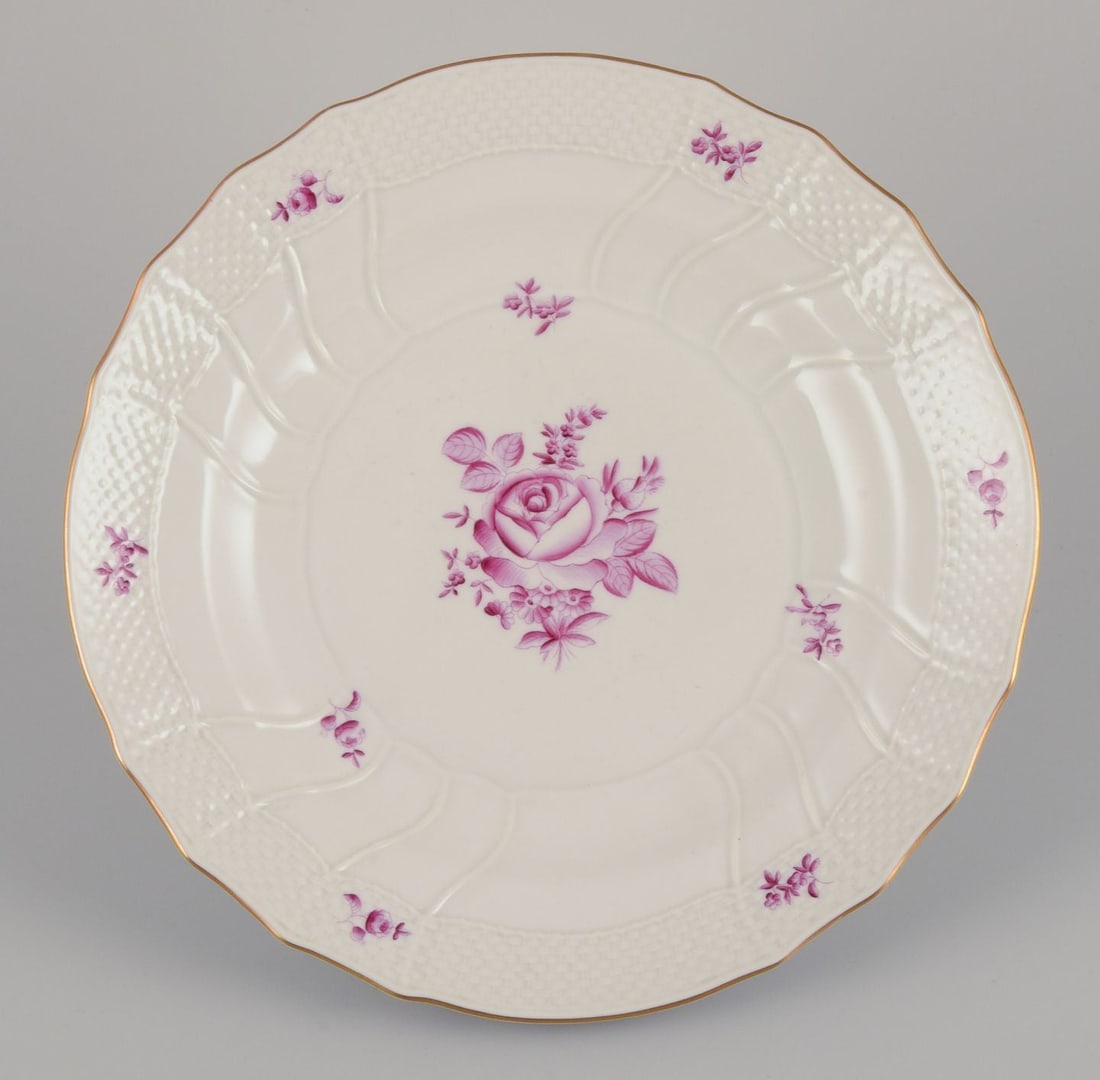 Herend, Hungary. A set of six porcelain dinner plates with purple floral motifs. Mid-20th C. - 6