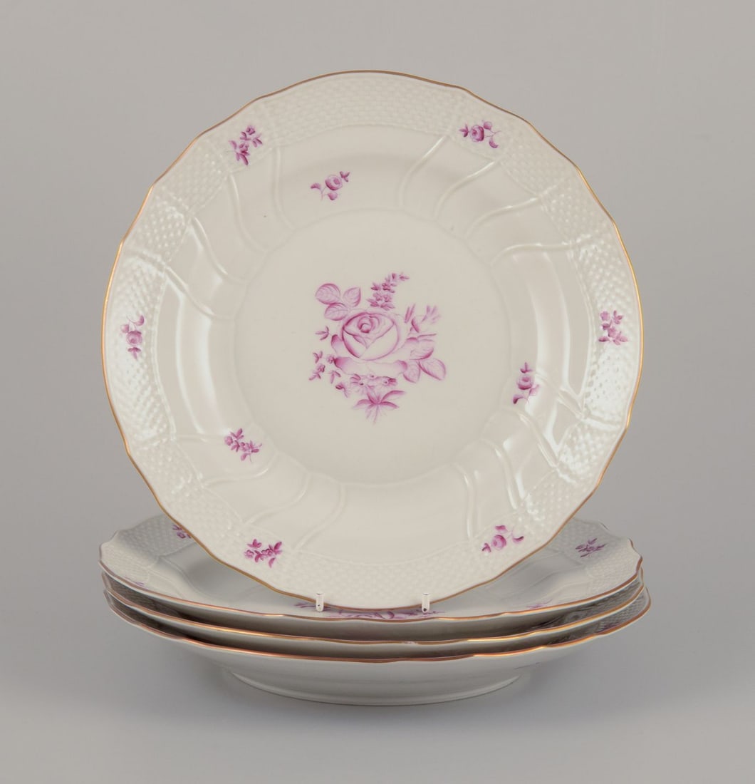 Herend, Hungary. A set of four porcelain dinner plates with purple floral motifs. Mid-20th C (1 of 9)