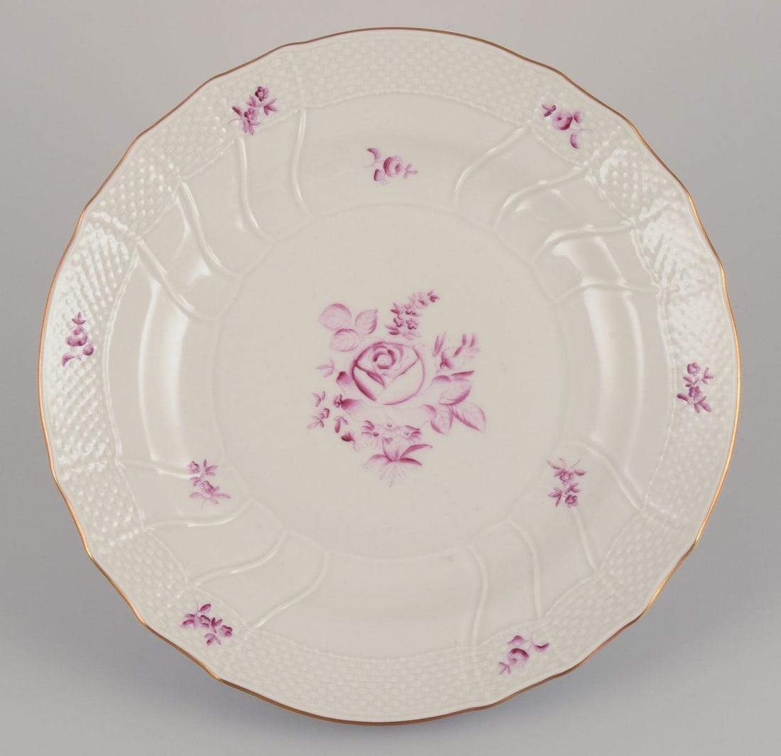 Herend, Hungary. A set of four porcelain dinner plates with purple floral motifs. Mid-20th C - 4