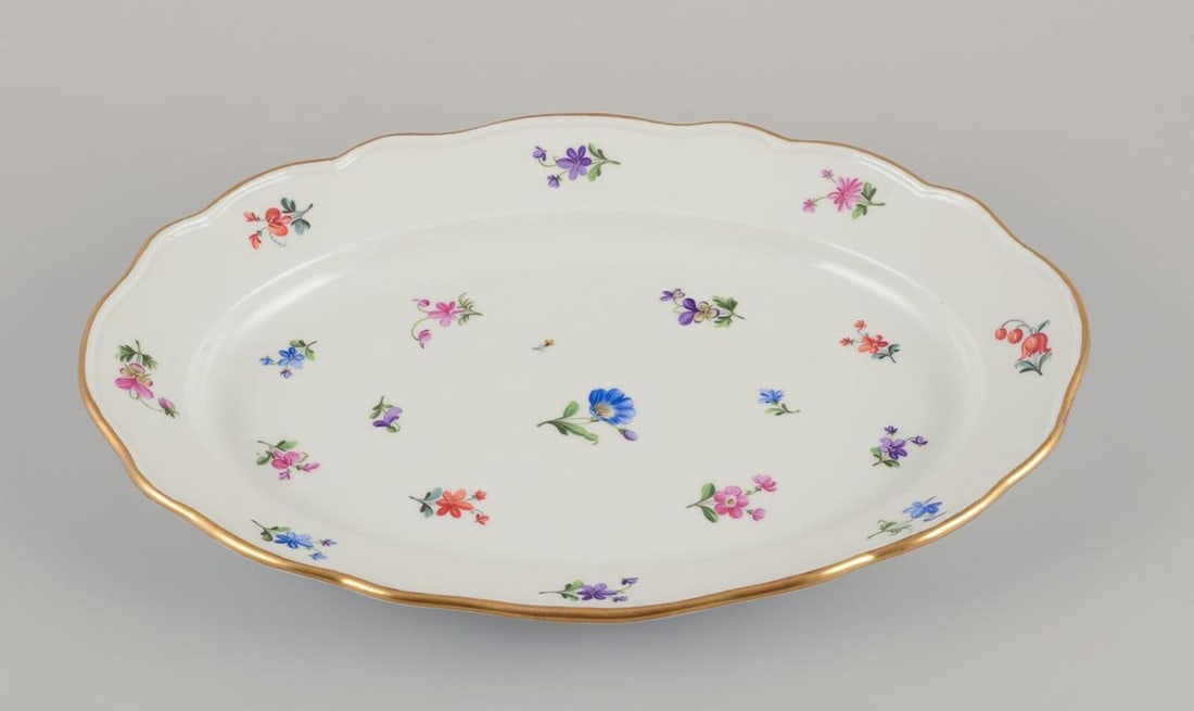 Meissen, Germany. Two oval serving platters in porcelain with polychrome floral motifs. Approx. from - 3