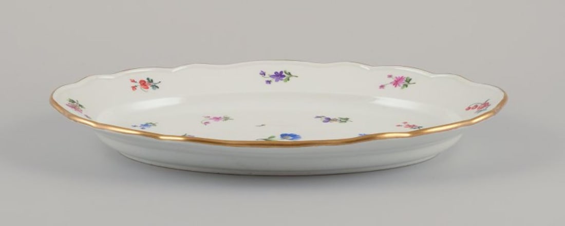 Meissen, Germany. Two oval serving platters in porcelain with polychrome floral motifs. Approx. from - 4