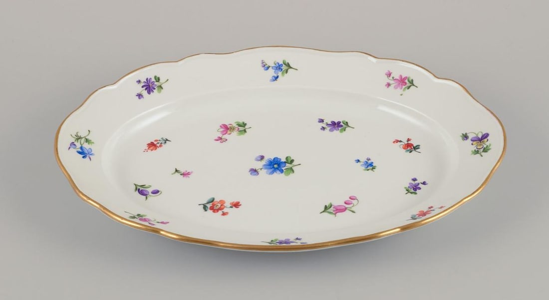 Meissen, Germany. Two oval serving platters in porcelain with polychrome floral motifs. Approx. from - 5