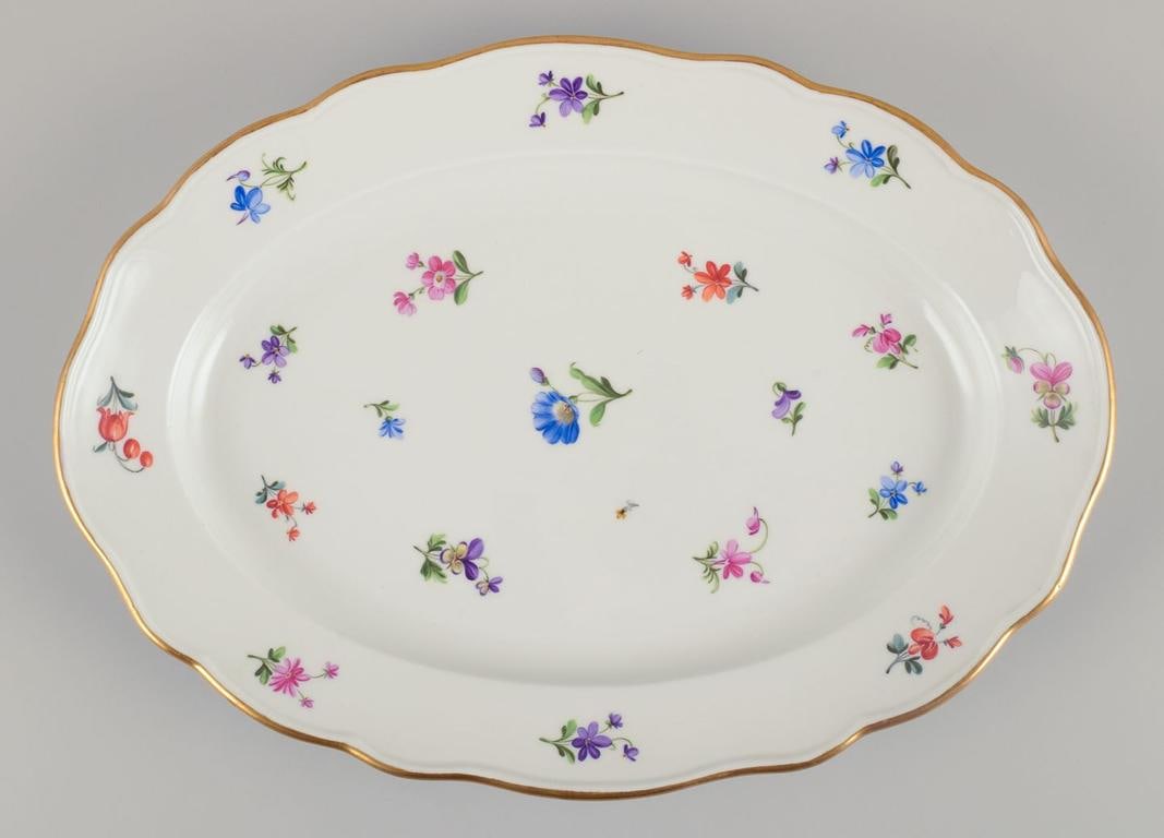 Meissen, Germany. Two oval serving platters in porcelain with polychrome floral motifs. Approx. from - 7