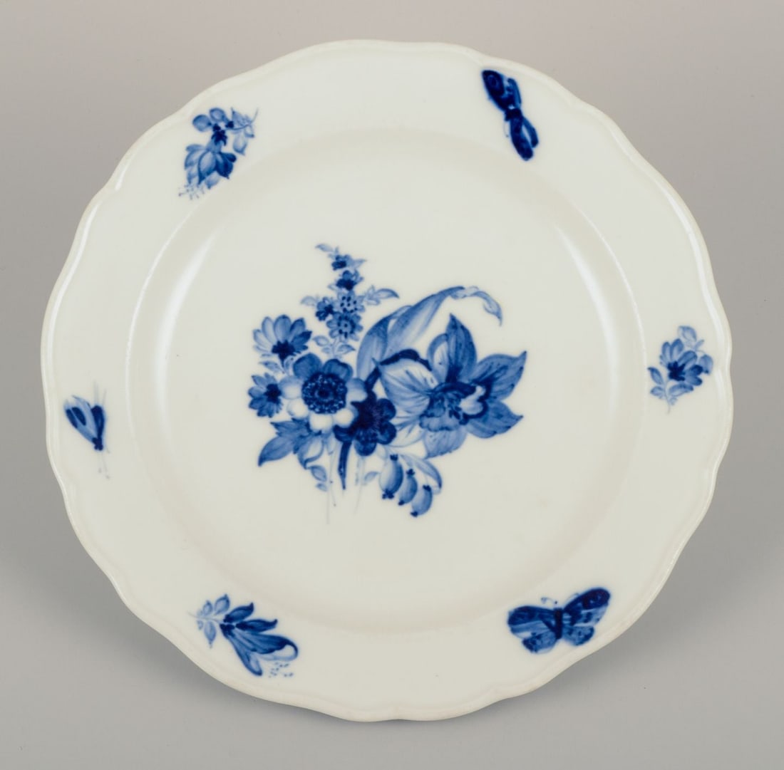 Meissen, Germany. Four porcelain lunch plates with floral motifs and insects in blue. Approx. - 3