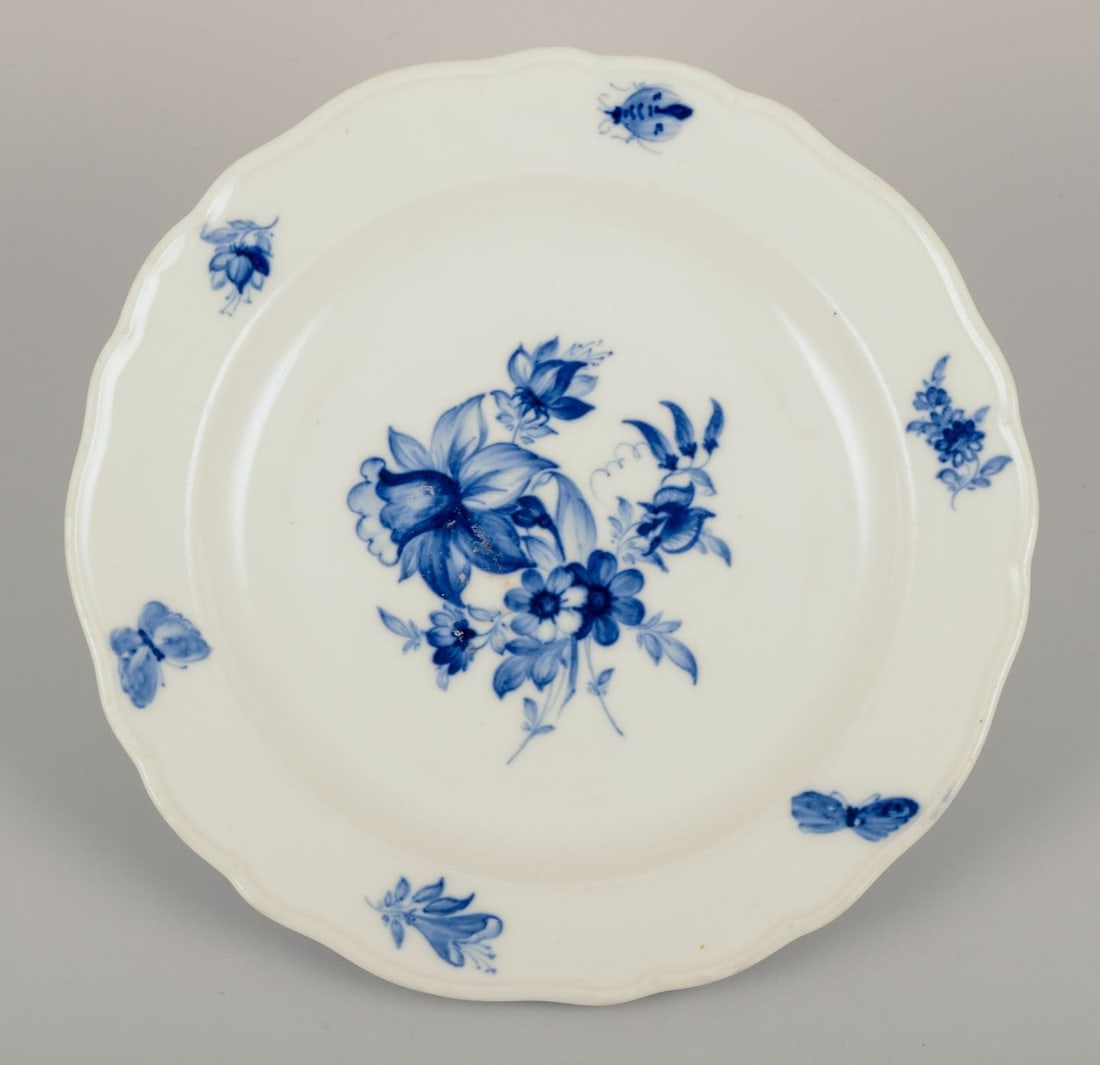Meissen, Germany. Four porcelain lunch plates with floral motifs and insects in blue. Approx. - 4