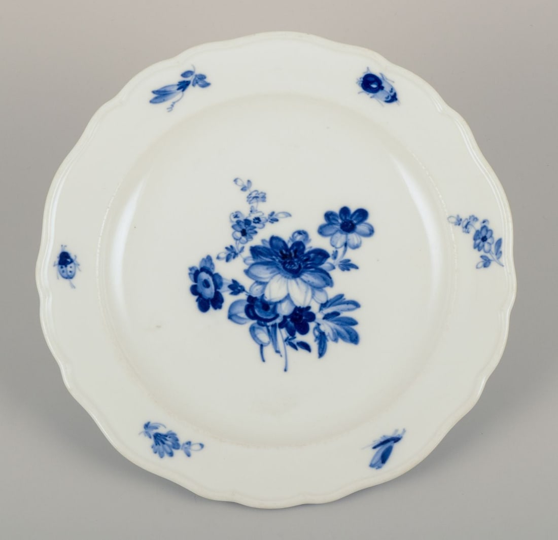 Meissen, Germany. Four porcelain lunch plates with floral motifs and insects in blue. Approx. - 6