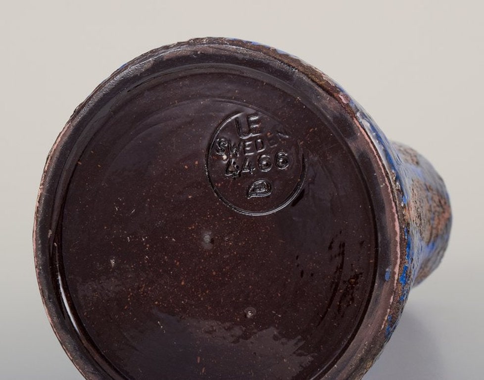 Mari Simmulson for Upsala Ekeby, Sweden. Ceramic vase with blue and earth-tone glaze. Approximately - 7