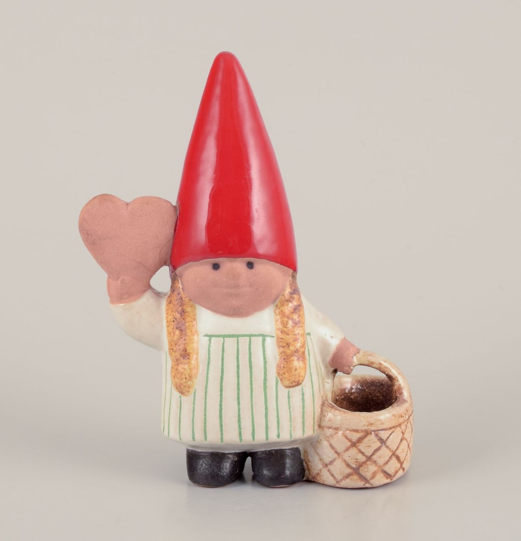 Lisa Larson for Gustavsberg. Elf girl with braided basket and honey heart. Late 20th C.: Lisa Larson for Gustavsberg. Elf girl with braided basket and honey heart. Late 20th century. In perfect condition. Signed. Dimensions: W 11.0 cm x H 14.0 cm.; Lisa Larson for Gustavsberg. Elf girl wi
