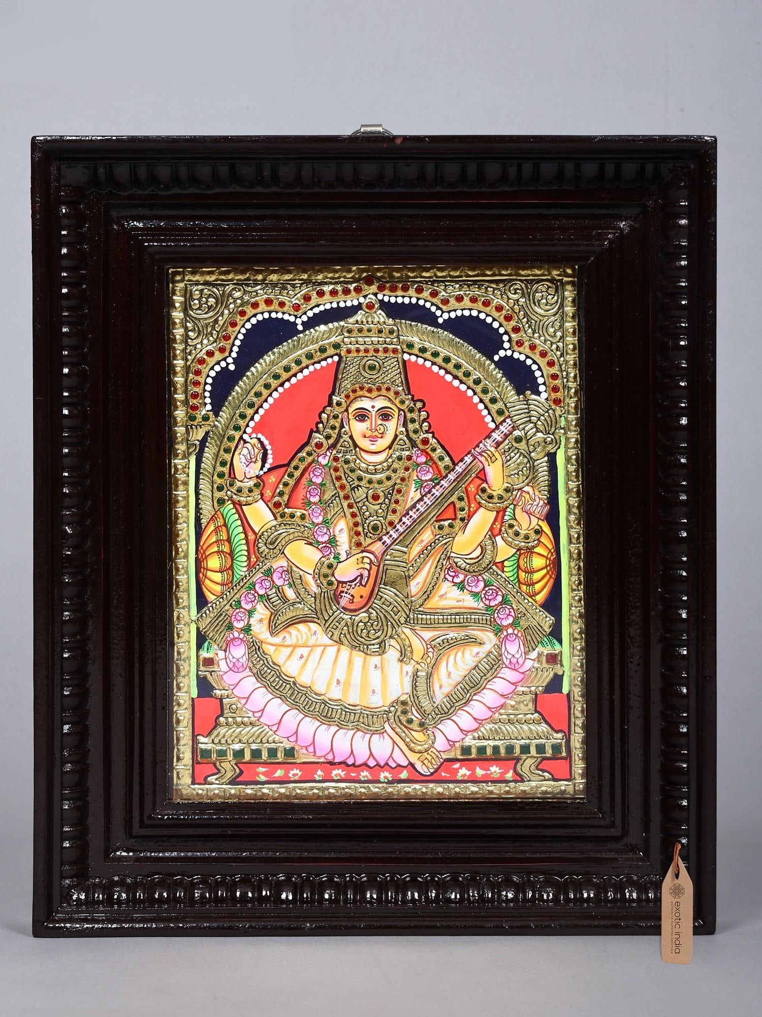 Seated Goddess Saraswati Holding Veena | Tanjore Painting | Traditional Colors with Gold Work: Title: Seated Goddess Saraswati Holding Veena | Tanjore Painting | Traditional Colors with Gold Work Description: Tanjore (Thanjavur) Painting Reserve: $202.00 Shipping: Domestic: Shipping rates are