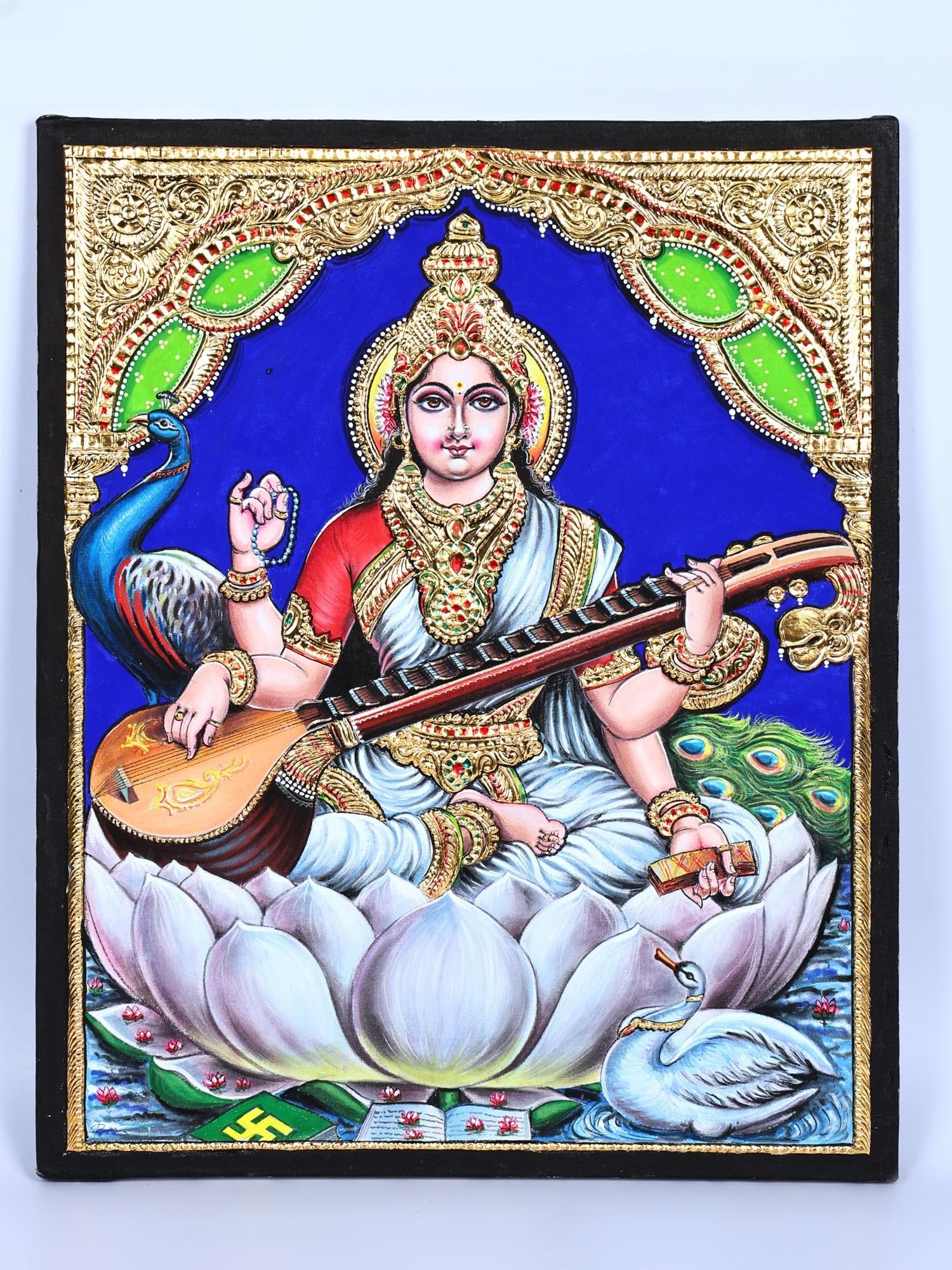 Devi Saraswati Seated on Shwet Kamal | 24 Karat Gold Work | Tanjore Painting: Title: Devi Saraswati Seated on Shwet Kamal | 24 Karat Gold Work | Tanjore Painting Description: Tanjore (Thanjavur) Painting Reserve: $590.00 Shipping: Domestic: Shipping rates are determined by dest