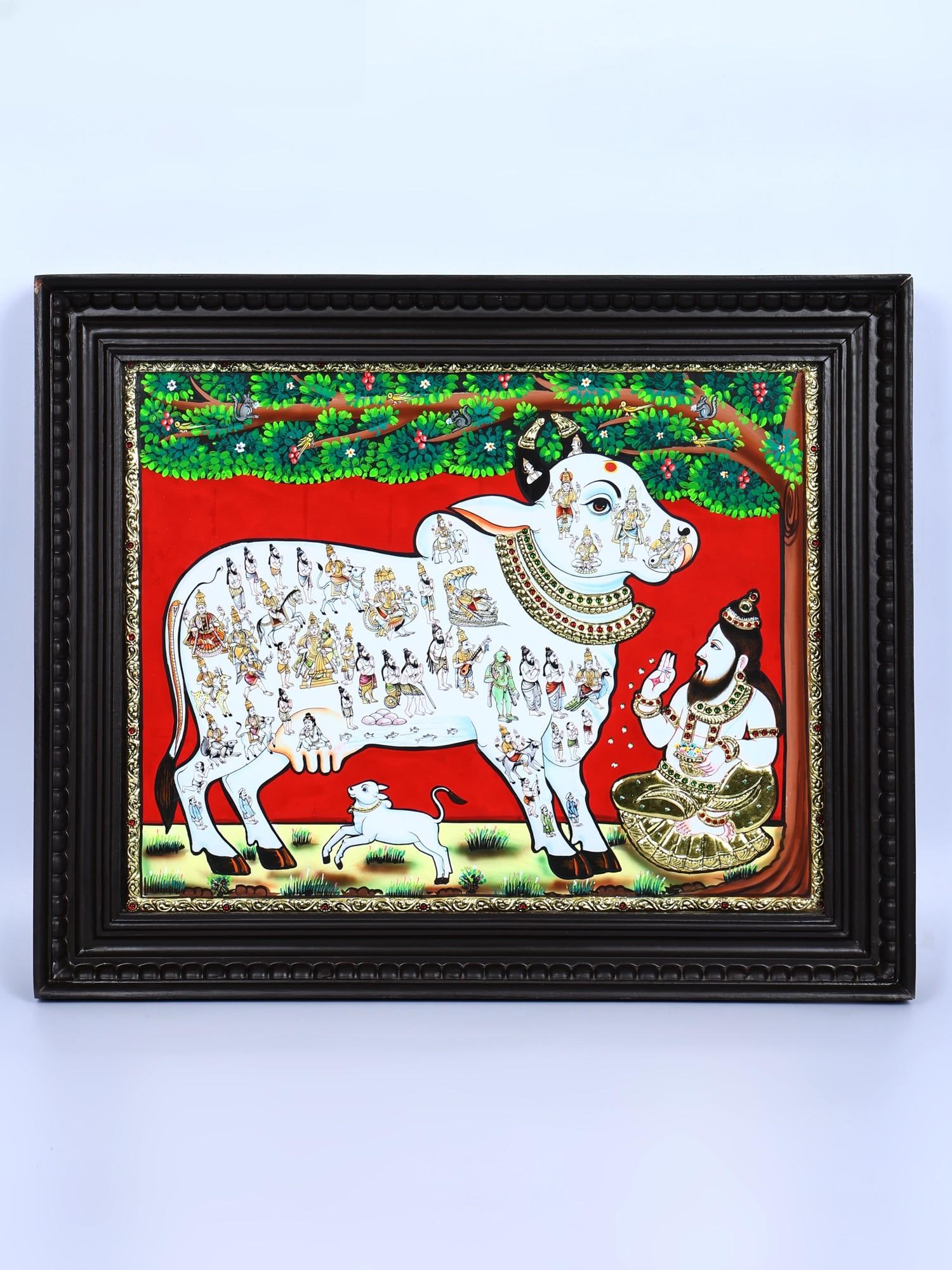 Goddess Kamadhenu Worshipped by Vashista Muni | 24 Karat Gold Work | Framed Tanjore Painting: Title: Goddess Kamadhenu Worshipped by Vashista Muni | 24 Karat Gold Work | Framed Tanjore Painting Description: Tanjore (Thanjavur) Painting Reserve: $512.00 Shipping: Domestic: Shipping rates are