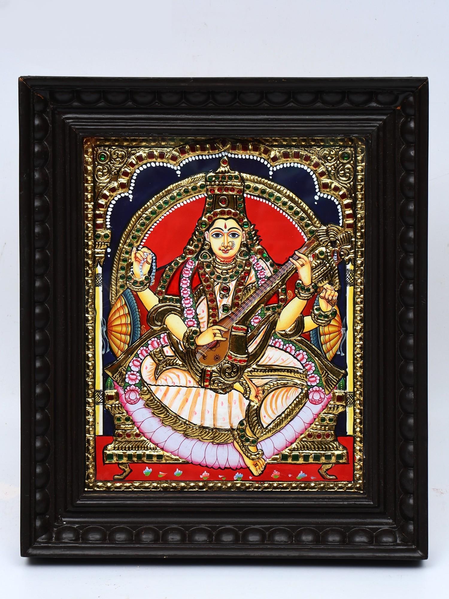 Devi Saraswati | Framed Tanjore Painting: Title: Devi Saraswati | Framed Tanjore Painting Description: Tanjore (Thanjavur) Painting Reserve: $171.00 Shipping: Domestic: Shipping rates are determined by destination International: Foreign shipp