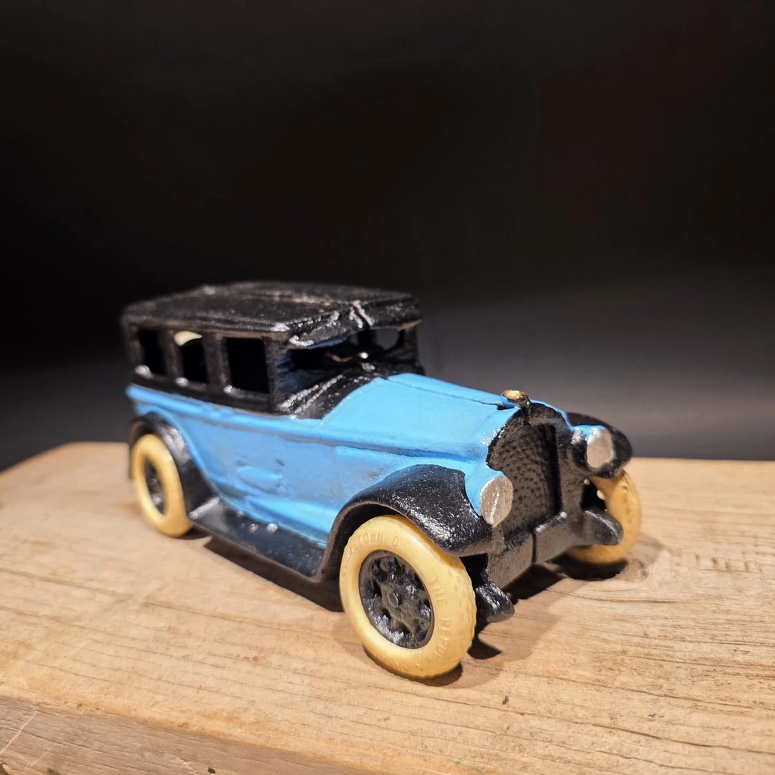 Blue Cast Iron Toy Race Car: 8" Long Such a neat reproduction cast iron car! As you can see this heavy cast iron car was wonderfully hand painted and distressed to look original. The car is mostly blue with rubber wheels. Very so