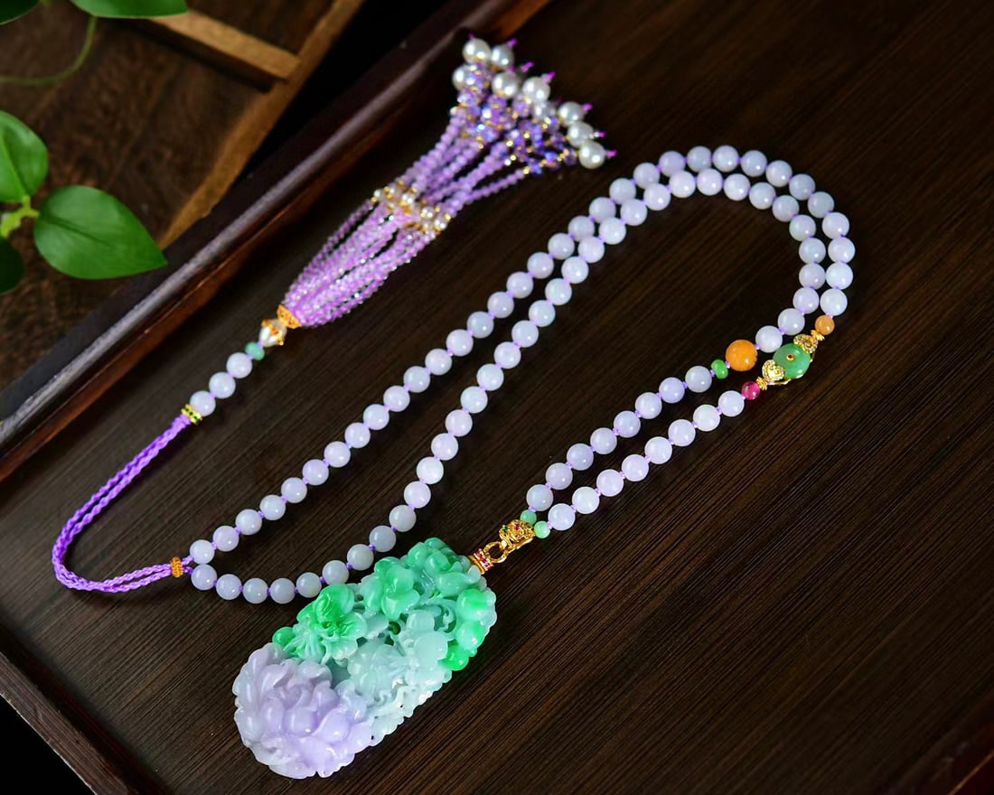 Jadeite Hand-Carved Pendant w Peony & Hand Woven Purple Jadeite Beads Necklace: Title: Jadeite Hand-Carved Pendant w Peony & Hand Woven Purple Jadeite Beads Necklace Origin: Chinese Date/Period: After2026 Materials: Jadeite Dimensions: 62.6x33.7x10.6(mm) 2.46x1.33x0.42(inches) Re