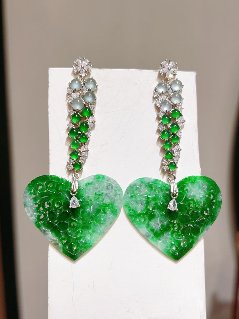 A Pair Silver & Green Jadeite Heart-shaped Earrings: Title: A Pair Silver & Green Jadeite Heart-shaped Earrings Origin: Chinese Date/Period: After2026 Materials: Silver,Jadeite Dimensions: Reserve: $399.00 Shipping: Domestic: Shipping rates are