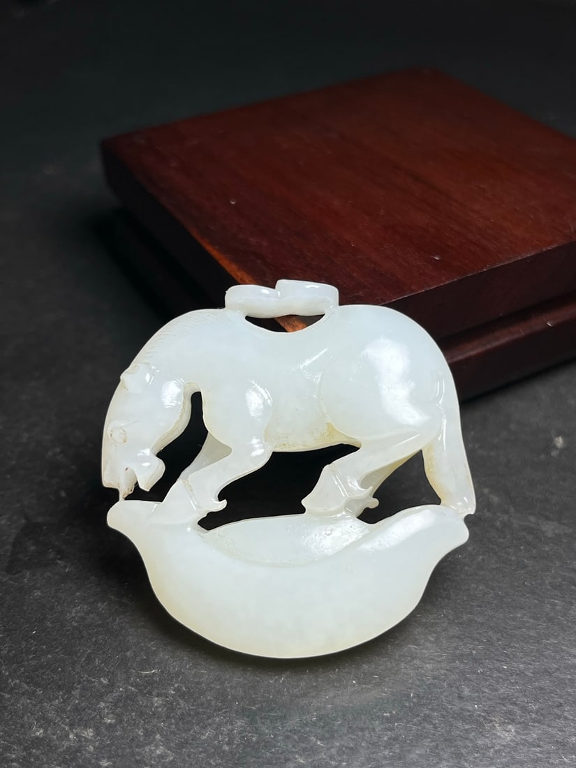 Hetian Jade Hand Carved Fortune Horse Pendant: Title: Hetian Jade Hand Carved Fortune Horse Pendant Origin: Chinese Date/Period: After2000 Materials: Hetian Jade Dimensions: 51x50x12(mm) 2.01x1.97x0.47(inches) Weight 0.09 lbs/40g Reserve: $499.00