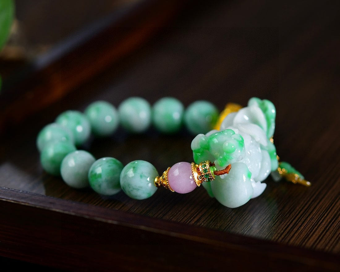 Green Jadeite Hand Carved Lotus Bracelet with Certificate: Title: Green Jadeite Hand Carved Lotus Bracelet with Certificate Origin: Chinese Date/Period: After2020 Materials: Jadeite Dimensions: 36x25x15(mm) 1.42x0.98x0.59(inches) Reserve: $499.00 Shipping: