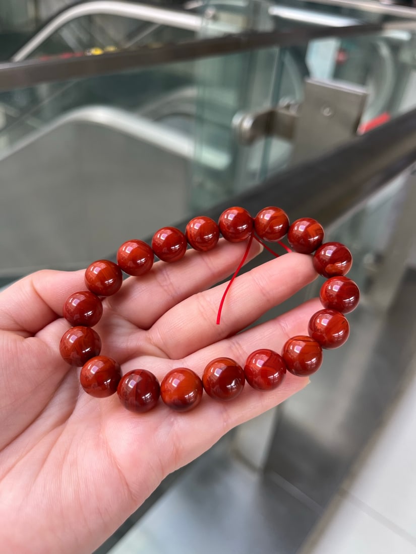 11.5mm Nanhong Agate Beads Bracelet with Certificate: Title: 11.5mm Nanhong Agate Beads Bracelet with Certificate Origin: Chinese Date/Period: After2020 Materials: Nanhong Agate Dimensions: 11.5(mm) 0.45(inches) Weight 0.09 lbs/40g Reserve: $399.00