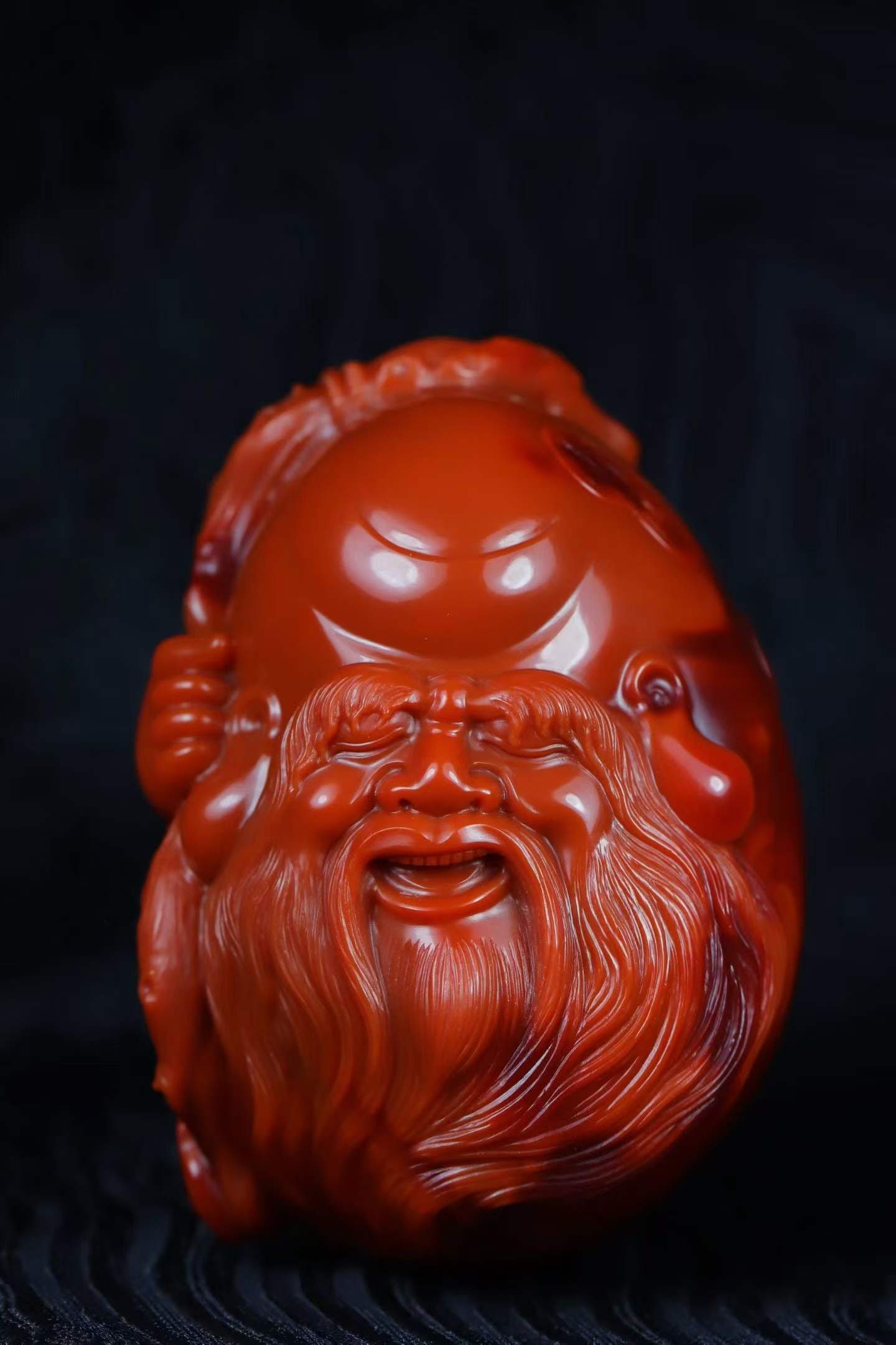 Nanhong Agate Hand Carved Longevity Taoism Deity Pendant: Title: Nanhong Agate Hand Carved Longevity Taoism Deity Pendant Origin: Chinese Date/Period: After2026 Materials: Nanhong Agate Dimensions: 56x40x37(mm) 2.20x1.57x1.46(inches) Weight 0.22 lbs/100.8g