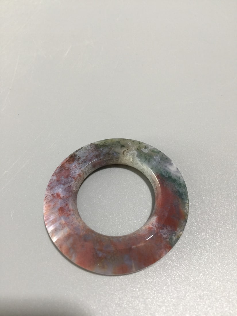 Shuicao Agate Lucky Ring Pendnat: Title: Shuicao Agate Lucky Ring Pendnat Origin: Chinese Date/Period: After2020 Materials: Agate Dimensions: Reserve: $150.00 Shipping: Domestic: Shipping rates are determined by destination