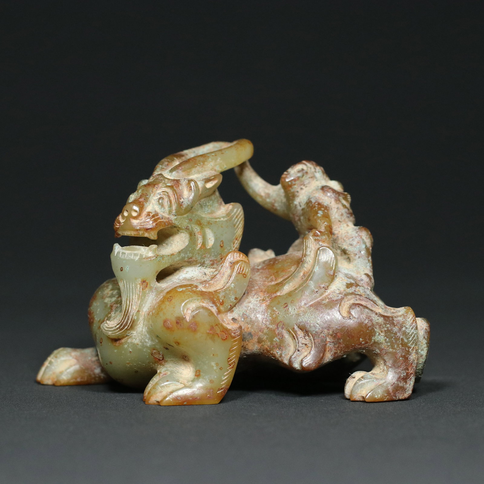 Old Hetian Jade Beast Statue: Title: Old Hetian Jade Beast Statue Origin: Chinese Date/Period: After1900 Materials: Hetian Jade Dimensions: 115x63x70(mm) 4.53x2.48x2.76(inches) Weight 0.87 lbs/395g Reserve: $499.00 Shipping:<