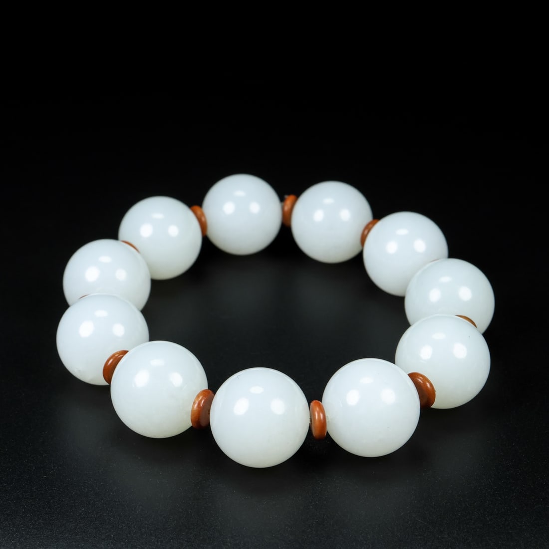 Hand Woven Natural White Hetian Jade Beads Bracelet: Title: Hand Woven Natural White Hetian Jade Beads Bracelet Origin: Chinese Date/Period: After2000 Materials: Hetian Jade Dimensions: 20 (mm) 0.79 (inches)Weight: 0.30 lbs/ 136.5 g Reserve: $1,599.00