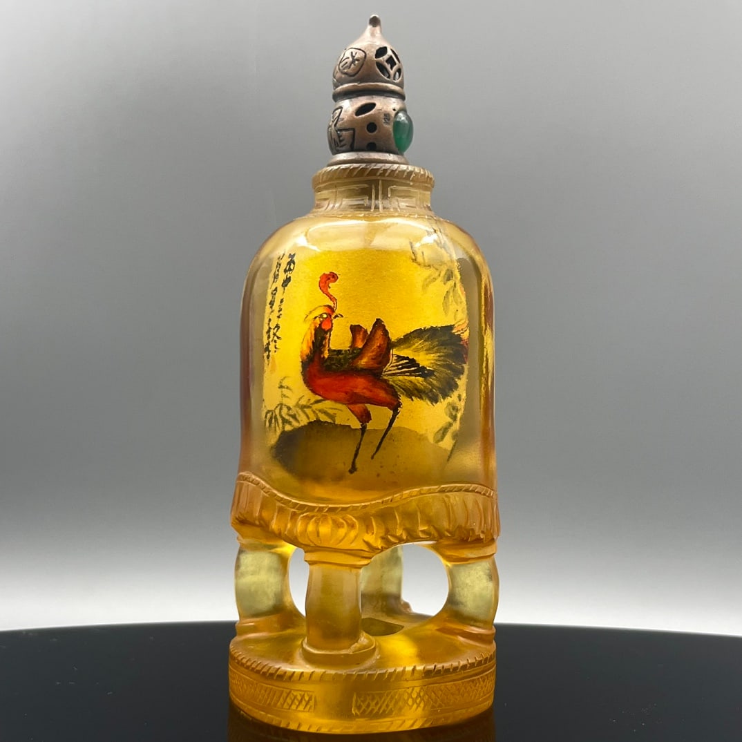 Yellow Peking Glass Inside Painting Phoenix Design Snuff Bottle w Stopper: Title: Yellow Peking Glass Inside Painting Phoenix Design Snuff Bottle w Stopper Origin: Chinese Date/Period: After1900 Materials: Yellow Peking Dimensions: 98 x 37 x 36 (mm) 3.86 x 1.46 x 1.42
