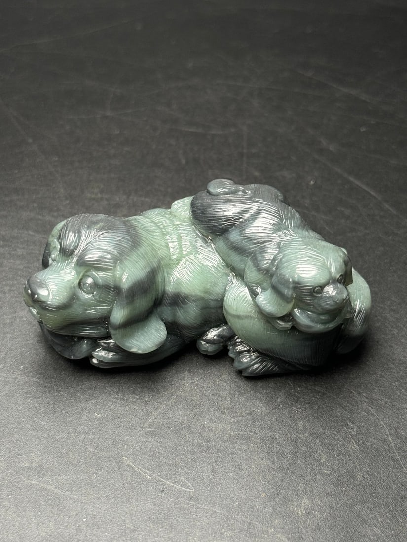 Natural Hetian Jade Hand-Carved Statue w Dog: Title: Natural Hetian Jade Hand-Carved Statue w Dog Origin: Chinese Date/Period: After2020 Materials: Hetian Jade Dimensions: 75 x 36 x 34 (mm) 2.95 x 1.42 x 1.34 (inches) Weight: 0.34 lbs/ 154 g Rese