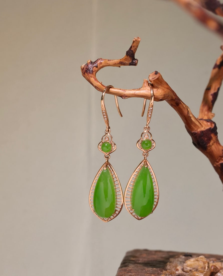 A Pair 18K Gold & Green Hetian Jade Earrings: Title: A Pair 18K Gold & Green Hetian Jade Earrings Origin: Chinese Date/Period: After2020 Materials: 18K Gold & Green Hetian Jade Dimensions: 16 x 7 (mm) 0.63 x 0.27 (inches) Reserve: $799.00
