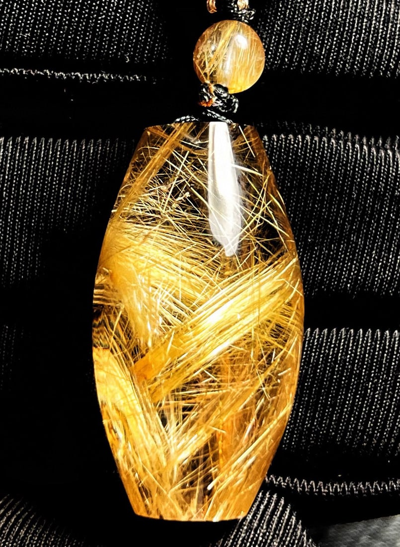 Rutilated Quartz Lucky Pendant: Title: Rutilated Quartz Lucky Pendant Origin: Chinese Date/Period: After2000 Materials: Rutilated Quartz Dimensions: 32 x 17 x 17 (mm) 1.26 x 0.67 x 0.67 (inches) Weight: 0.04 lbs/ 17.3 g Reserve: $49