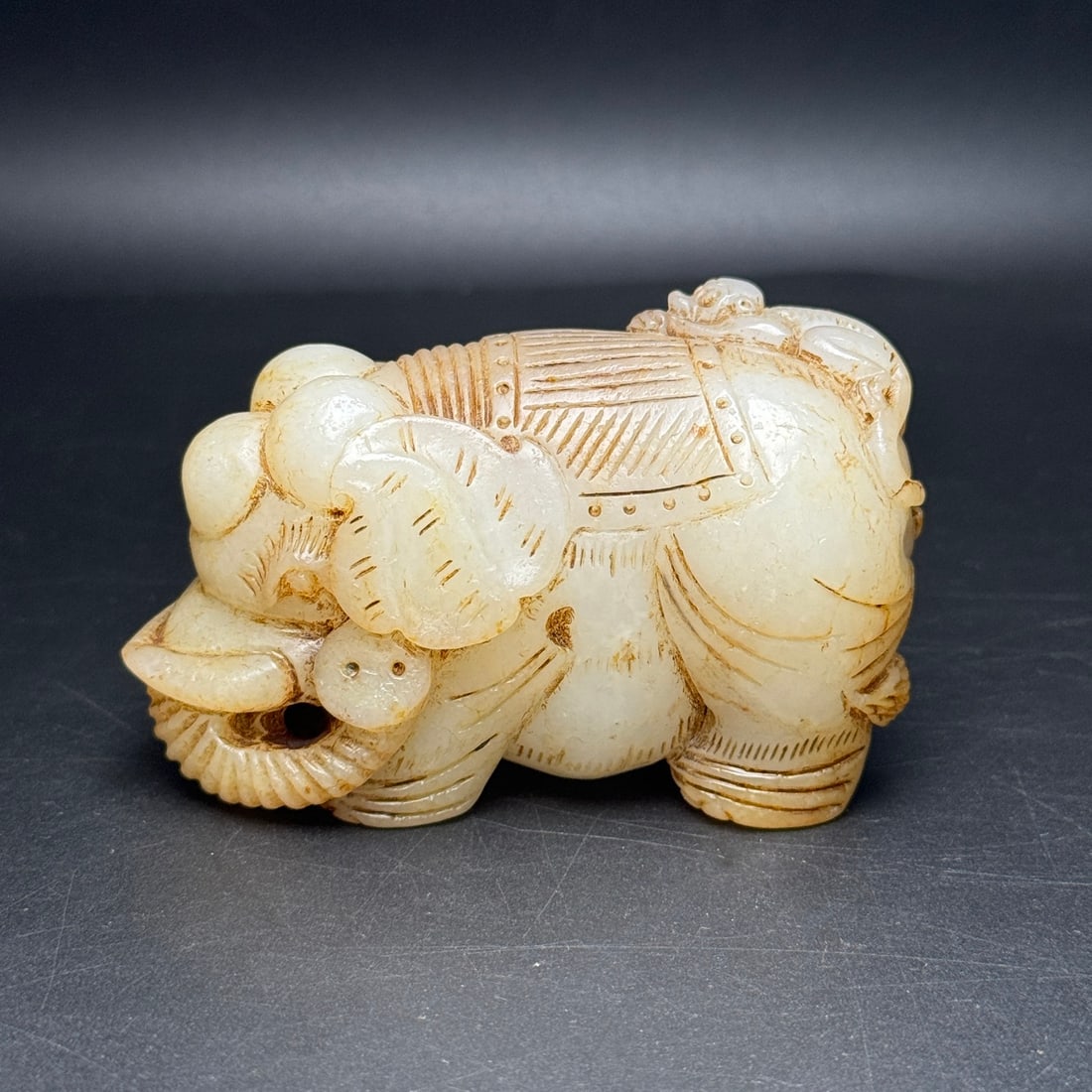 Old Hetian Jade Hand-Carved Statue w Elephant & Monkey: Title: Old Hetian Jade Hand-Carved Statue w Elephant & Monkey Origin: Chinese Date/Period: After1900 Materials: Hetian Jade Dimensions: 86 x 51 x 41 (mm) 3.38 x 2.01 x 1.61 (inches) Weight: 0.65 lbs/ 
