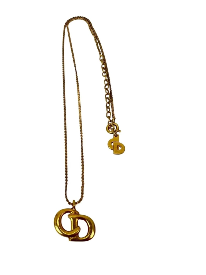 Christian Dior Gold Plated CD Pendent Necklace: Title: Christian Dior Gold Plated CD Pendent Necklace Description: Preowned Christian Dior Gold Plated CD Pendent Necklace RATING: B...well maintained, has little to no signs of wear CONDITION: CD