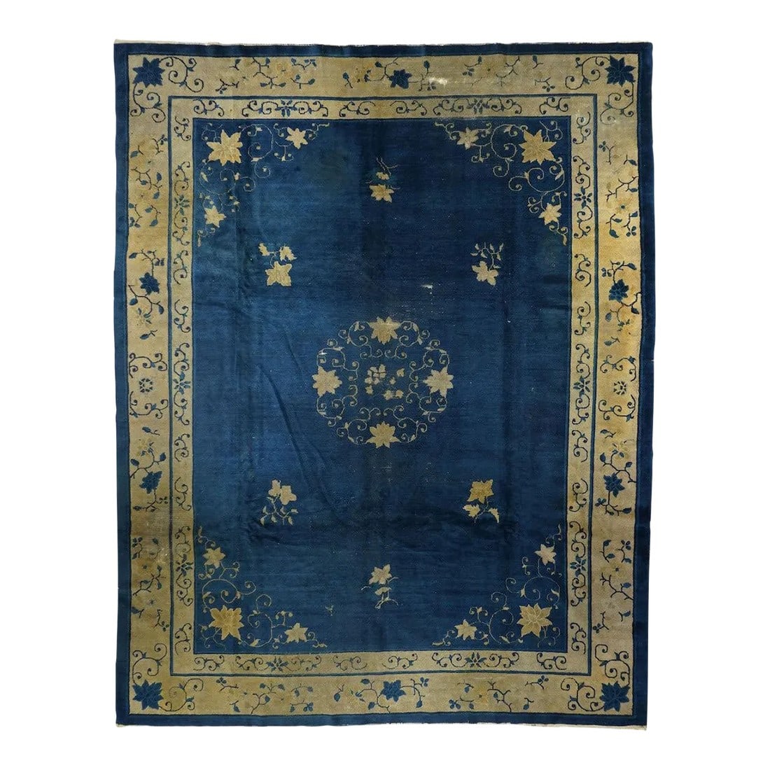 Antique Peking Rug 9'0'' x 11'5'': From northeast China, this export carpet shows a deep blue field organized by an open arabesque and four paeony medallion, around which easily flow six small tree paeonies, and paeony and spiral