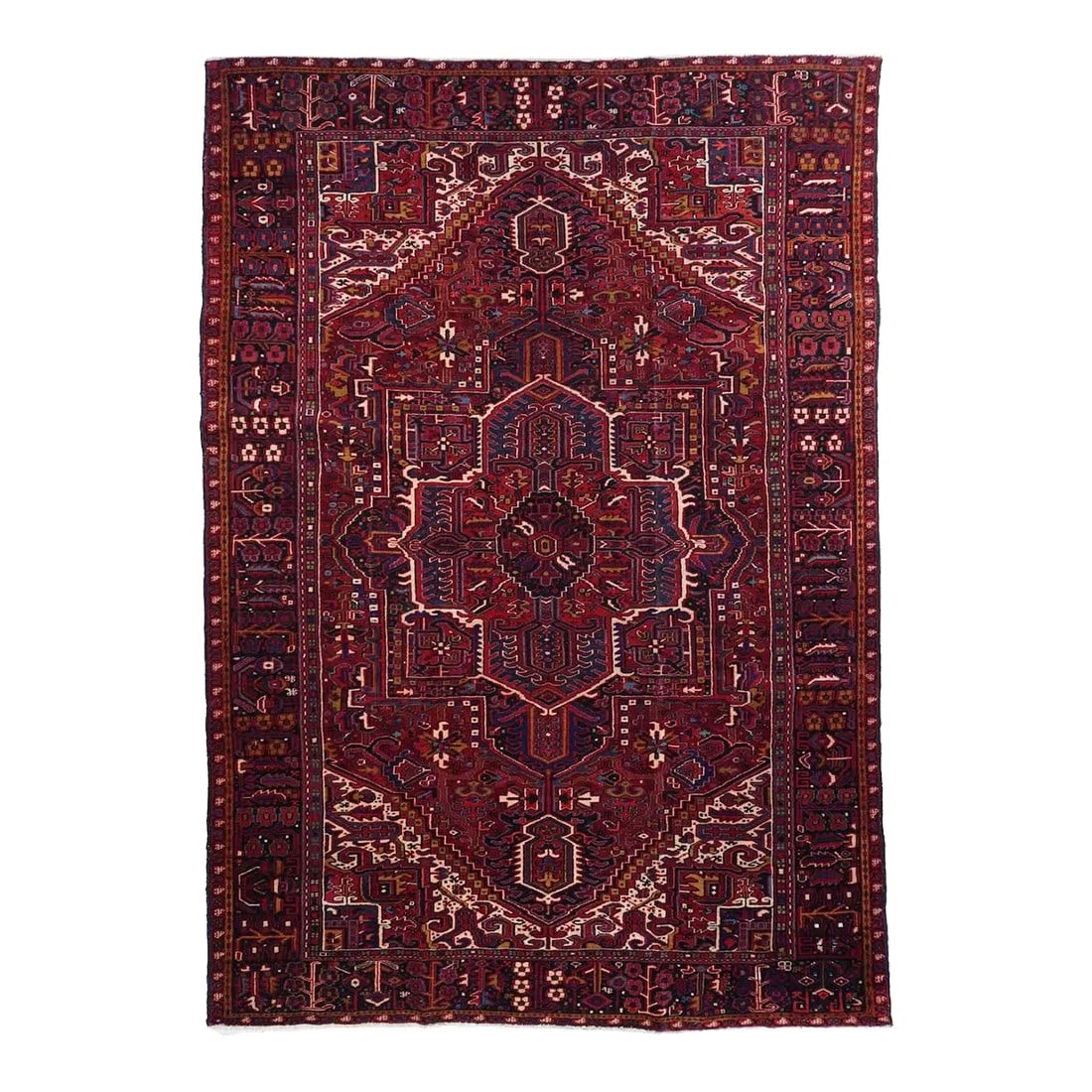Vintage Heriz Rug 8'0'' X 11'8'': A post-WWII carpet with saturated palette, but a traditional design. Red field with red medallion and stepped navy sub-medallion. Layered ragged palmette navy pendants and well-packed minor devices.