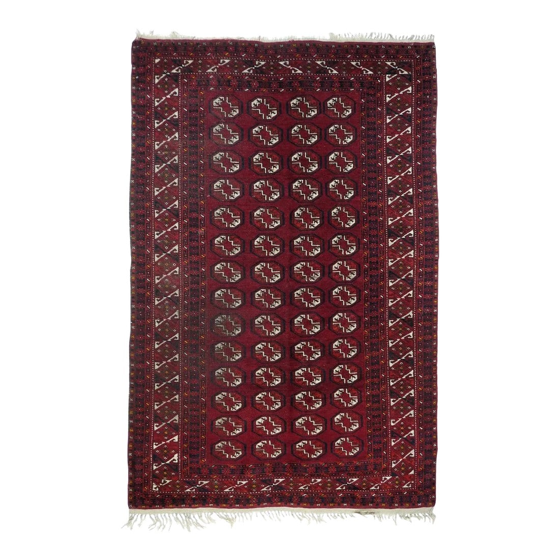 1970s Vintage Bokhara Rug 4'5'' x 7'0'': Possibly Saryk from the characteristic border, but more likely Tekke from NW Persia. The four column, 15 row pattern of quartered octagonal guls in ecru and burnt orange shows no minor guls in