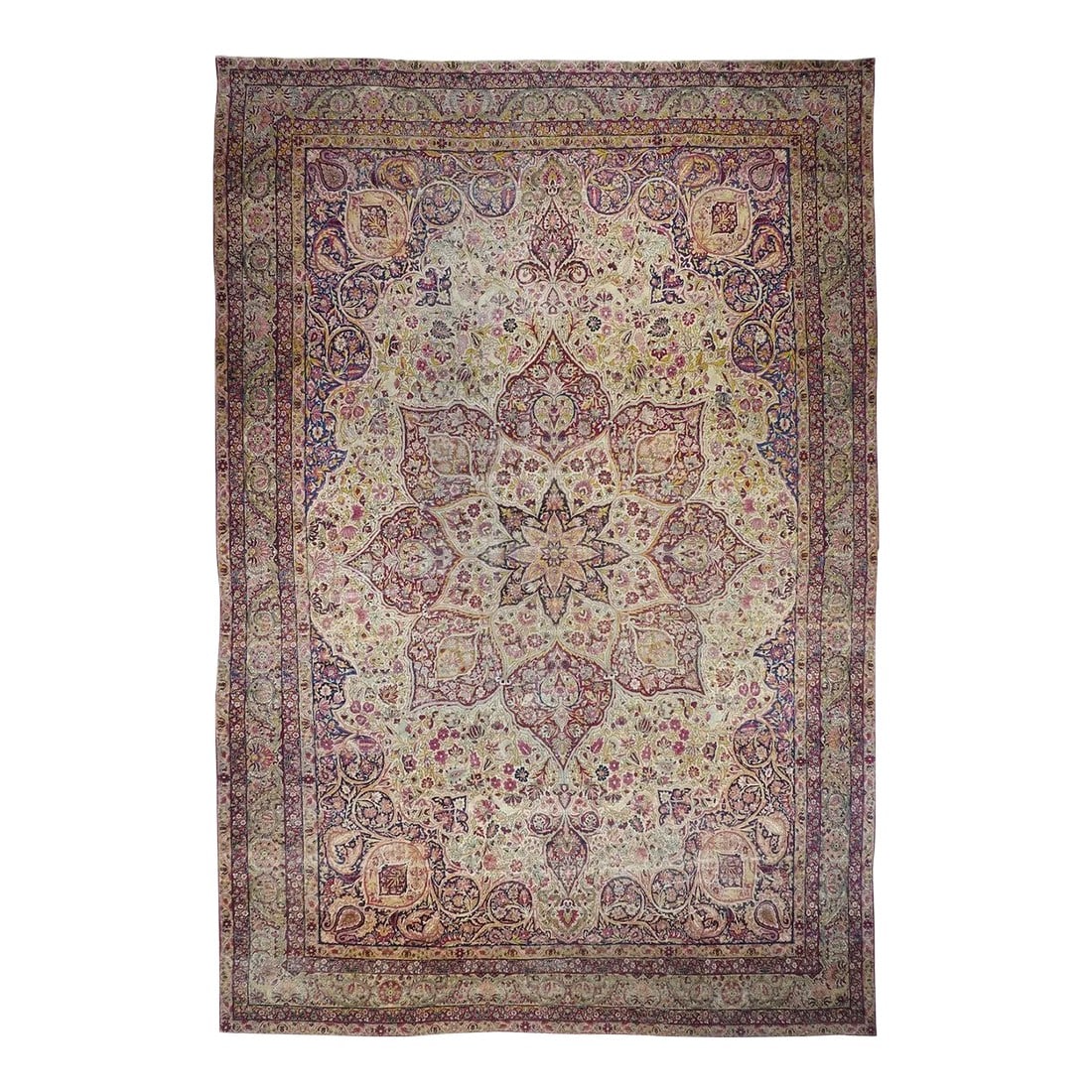 Late 18th Century Antique Ivory Lavar Kerman Rug 10'1'' x 14'11'': Laver is the trade designation for particularly finely woven antique Kermans and this room size certainly measures up with an ivory field displaying an effulgent eight point cochineal medallion