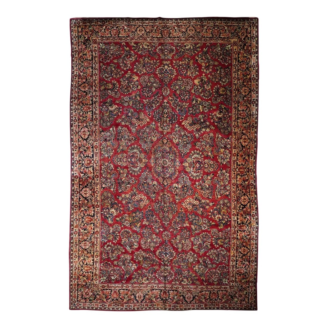 Antique Sarouk Rug 11'3'' x 18'1'': This 30's west Persian well-woven village carpet, shows the characteristic "American Sarouk" pattern of floating, detached floral sprays on a red ground. Cream, straw, teal and blue accents. Navy bord