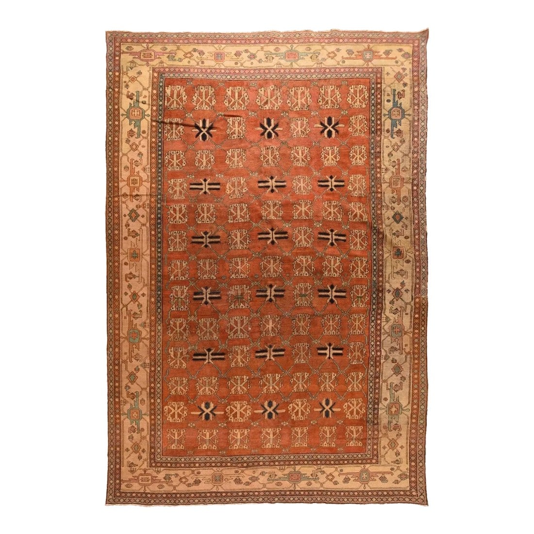 Late 19th Century Antique Bakshayesh Rug 11'4'' x 15'7'': The rust field of this rustic Central Asian piece shows a seven by thirteen arrangement of repeating stylized flowers and guls accented in straw and black. The darker detailed guls are in every second