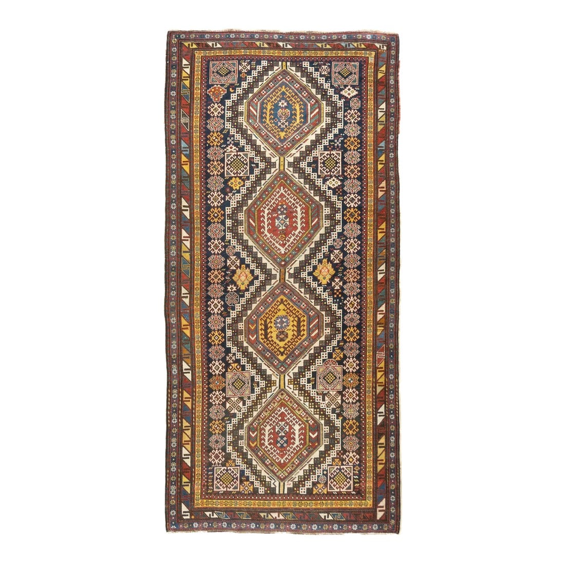 Late 18th Century Antique Caucasian Kuba Rug 4'9'' x 10': Azeri Turks inhabit the Kuba area of the central west Caspian Caucasus and weave a wide variety of geometric scatters, runners, long rugs and niche (prayer) pieces, in geometric allover and medallion