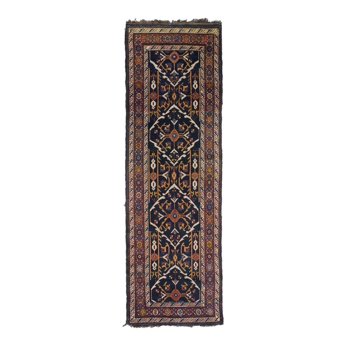 Late 18th Century Antique Bakhtiari Rug 3'0'' x 9'0'': This all-wool Kenare (runner) presents a navy indigo field with three tonally en suite hexagons edged uniformly by broken ecru acanthoids. Goldenrod stem-bars vertically connect the panels. Red