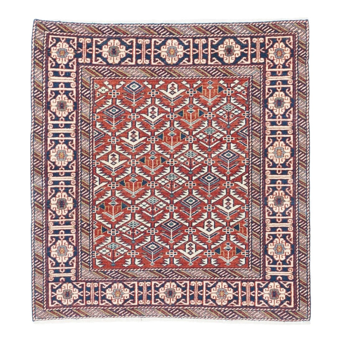 Antique Shrivan Rug 3'2'' x 3'4'': The madder red field displays an ivory serrated leaf hexagonal lattice with enclosed flowers, generally in the Shirvan-Daghestan style. A Kufesque knot and bracket border in brown-black is flanked by