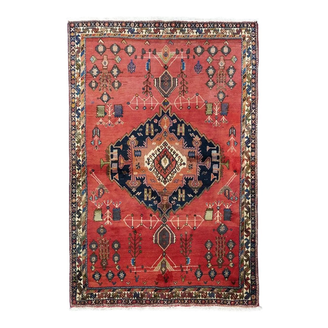 1970s Vintage Qashqai Rug 4'10'' x 7'5'': Sort of a Gabbeh, but much more complex in pattern, with a crimson field centred by a jagged navy medallion enclosing a fringed, barbed cartouche sub-medallion. Odd pendants and skeletal projections