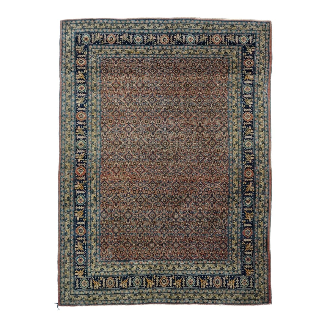 Antique Tabriz Rug 4'8'' x 6'3'': Northwestern Persia This urban carpet clearly shows a Heriz influence, with its semi-geometric drawing of a buff octofoil medallion centred by a light blue concentric sub-medallion. The ragged