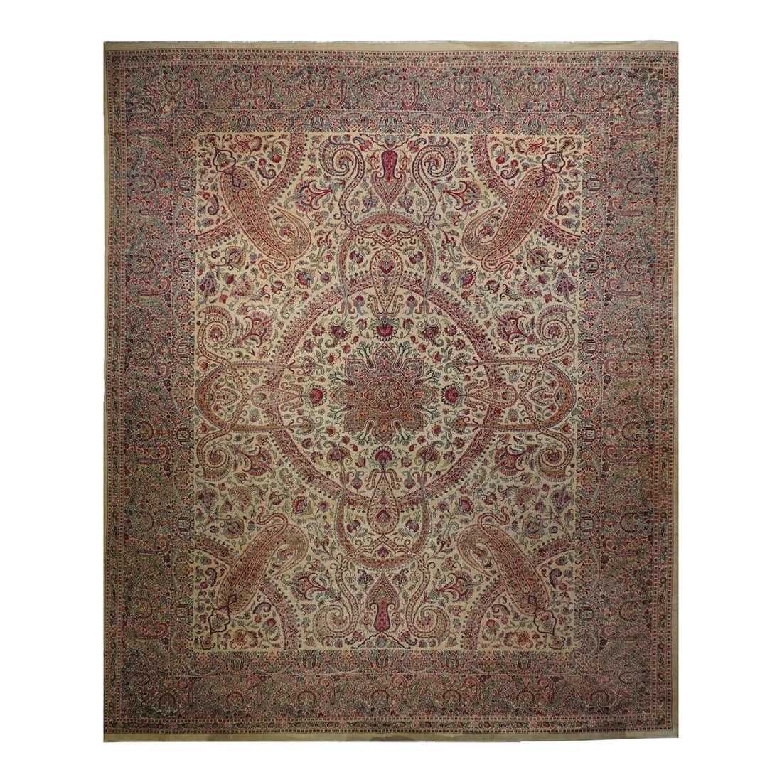 Antique Kerman Rug 11'3'' x 15'5'': With a general warm gold tonality, this interwar west Anatolian carpet shows an open medallion with two layers of blossoming volutes and curled acanthus leaves, with en suite pendants, on an open
